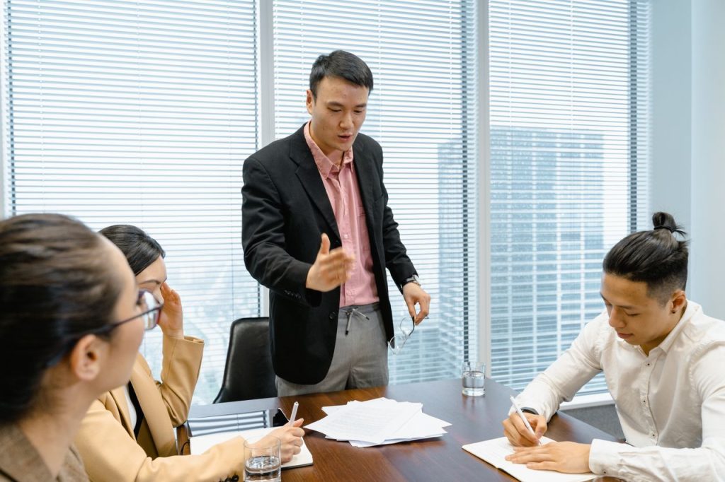 Demo Post 1 Business professionals discussing strategy during a corporate meeting in a modern boardroom.